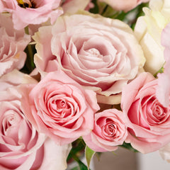 Bouquet of White Mondial Roses, Pink Mondial Roses, Pink Spray Roses, and Pink Lisianthus with Baby Eucalyptus and Thlaspi greeneries.