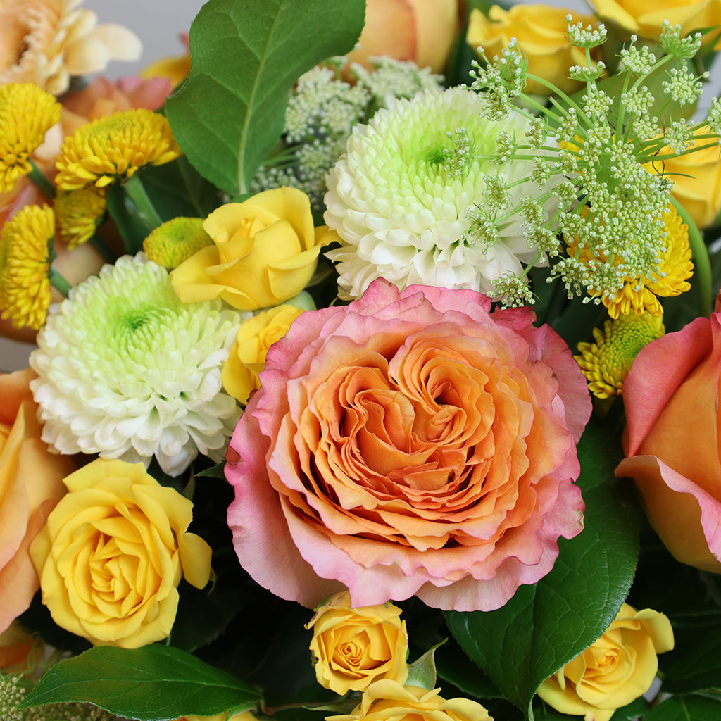 Bouquet of Free Spirit Roses, Yellow Spray Roses, Gerberas, and Pompom Mums with Lemon Leaves greeneries.